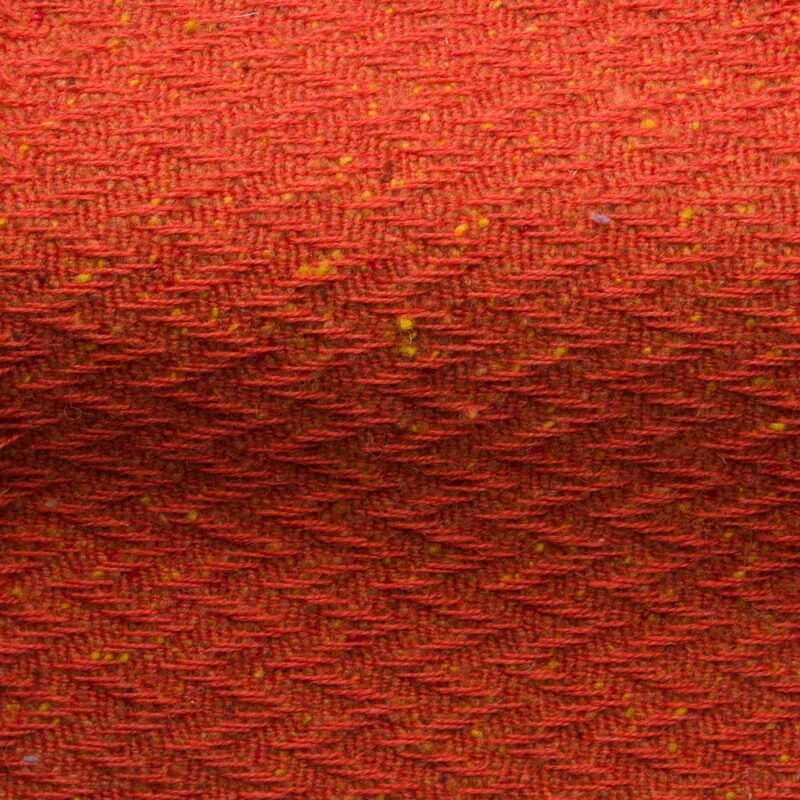 Textured high performance fabric for upholstery or heavy curtains in a Dusk Orange colour