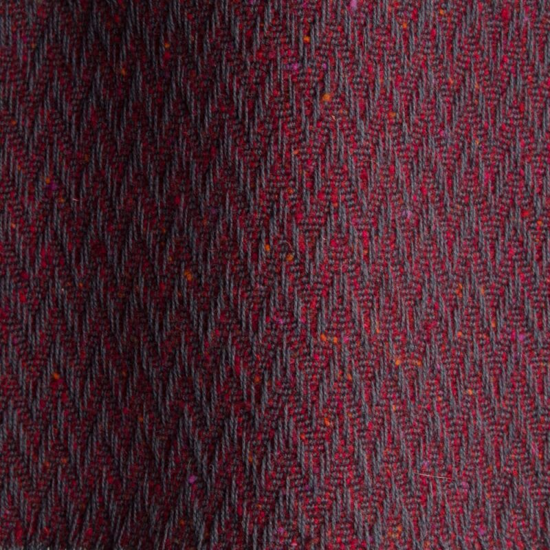 Textured high performance fabric for upholstery or heavy curtains in a Garnett colour