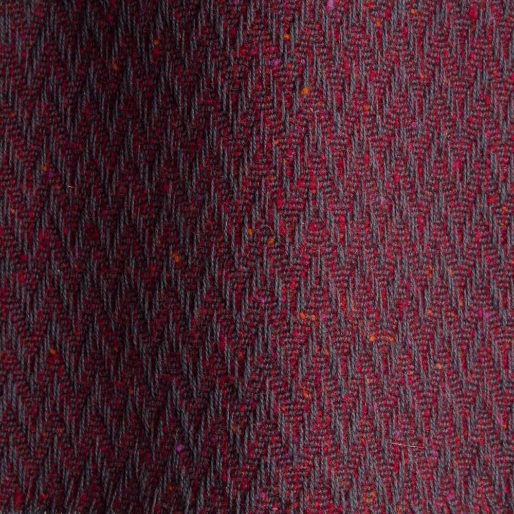 Textured high performance fabric for upholstery or heavy curtains in a Garnett colour