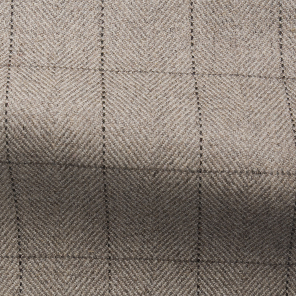 Grafton Herringbone Check Stone 27724 <strong>Grafton Herringbone Check in Stone </strong>A soft but durable herringbone fabric with an overcheck which is suitable for upholstery, drapes/curtains. Collection: The Shakespeare Collection Use: Upholstery, drapes/curtains and cushions Fire Retardancy: Cig & Match Pass, Crib 5 Available Width: 137 CM Rub: 40,000 Composition: 100% Wool <strong> </strong>